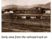 Early view from the railroad track on Sweetbrier. This photo shows the first Baptist Church and the first Washington School.1905